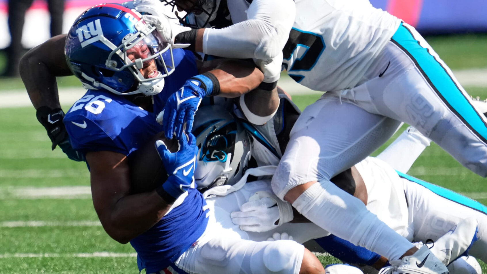 Saquon Barkley is driven into the ground