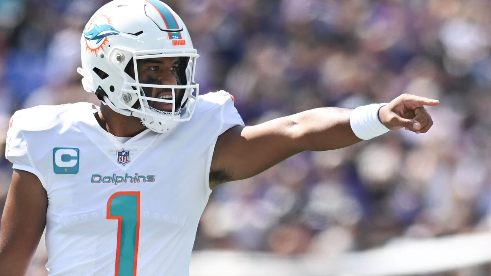 Miami Dolphins quarterback Tua Tagovailoa calls a play at the line