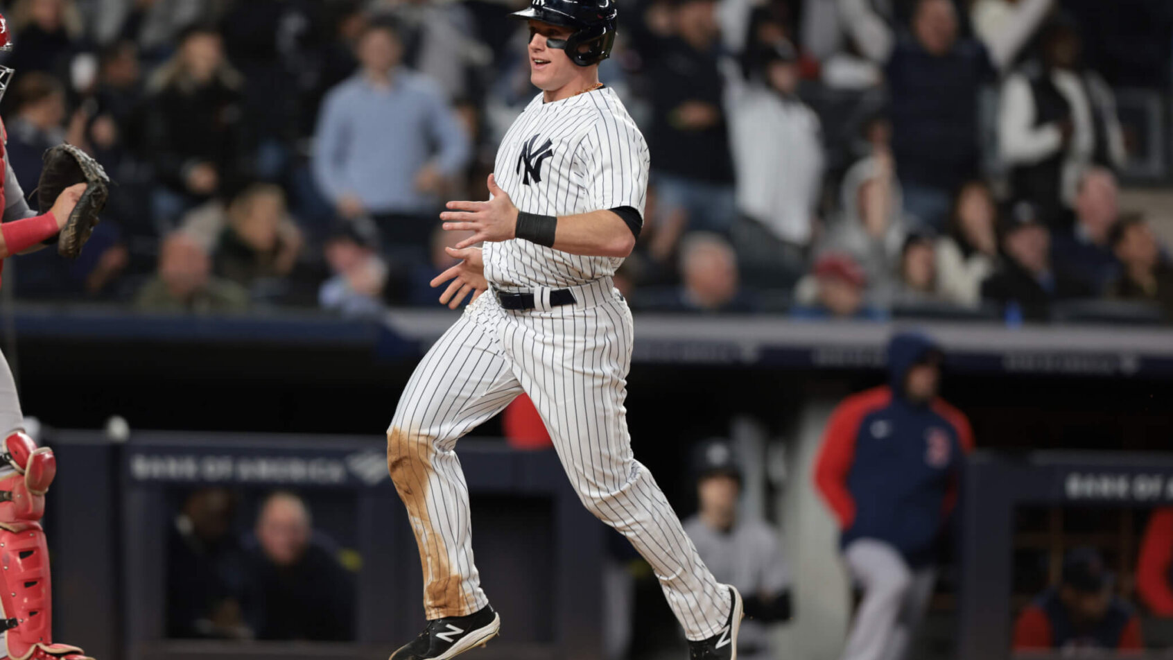 Harrison Bader running across home plate