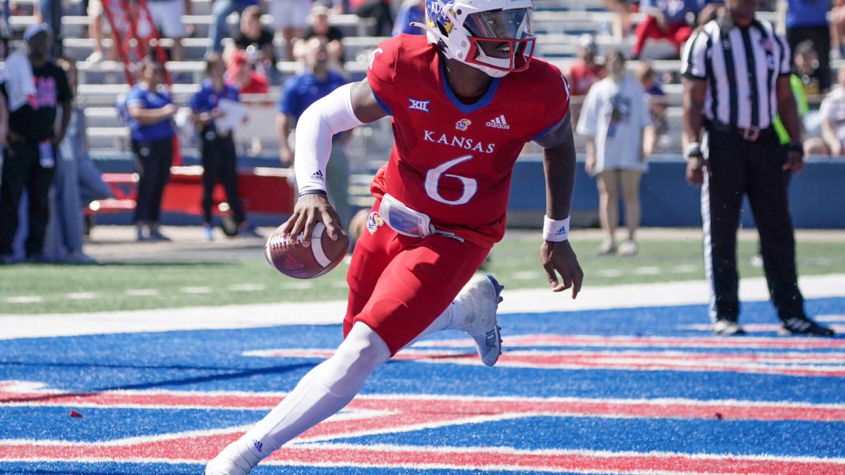 Kansas Jayhawks quarterback Jalon Daniels drops back to pass