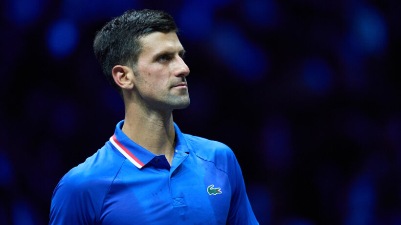 A mid shot of Novak Djokovic on the court.
