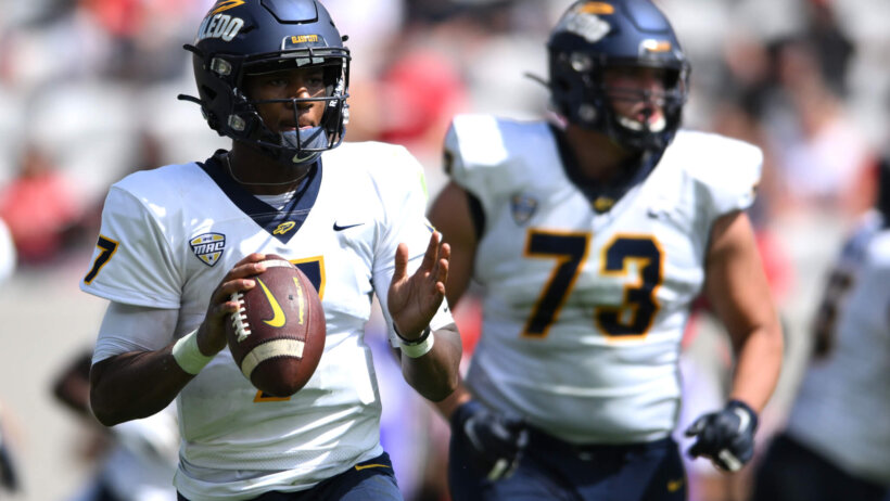 Toledo Rockets quarterback Dequan Finn looks to pass