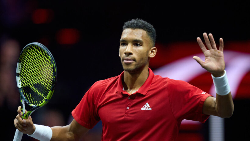 Felix Auger-Aliassime celebrating a win.