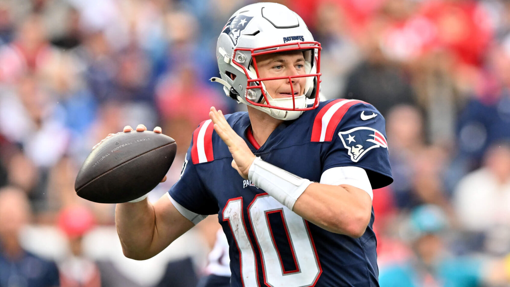 Mac Jones drops back to pass