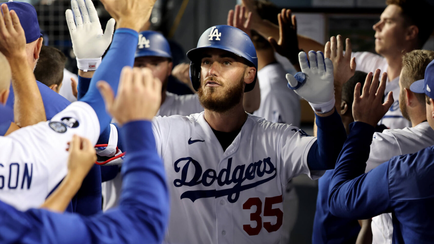 Cody Bellinger celebrating in dugout with teammates
