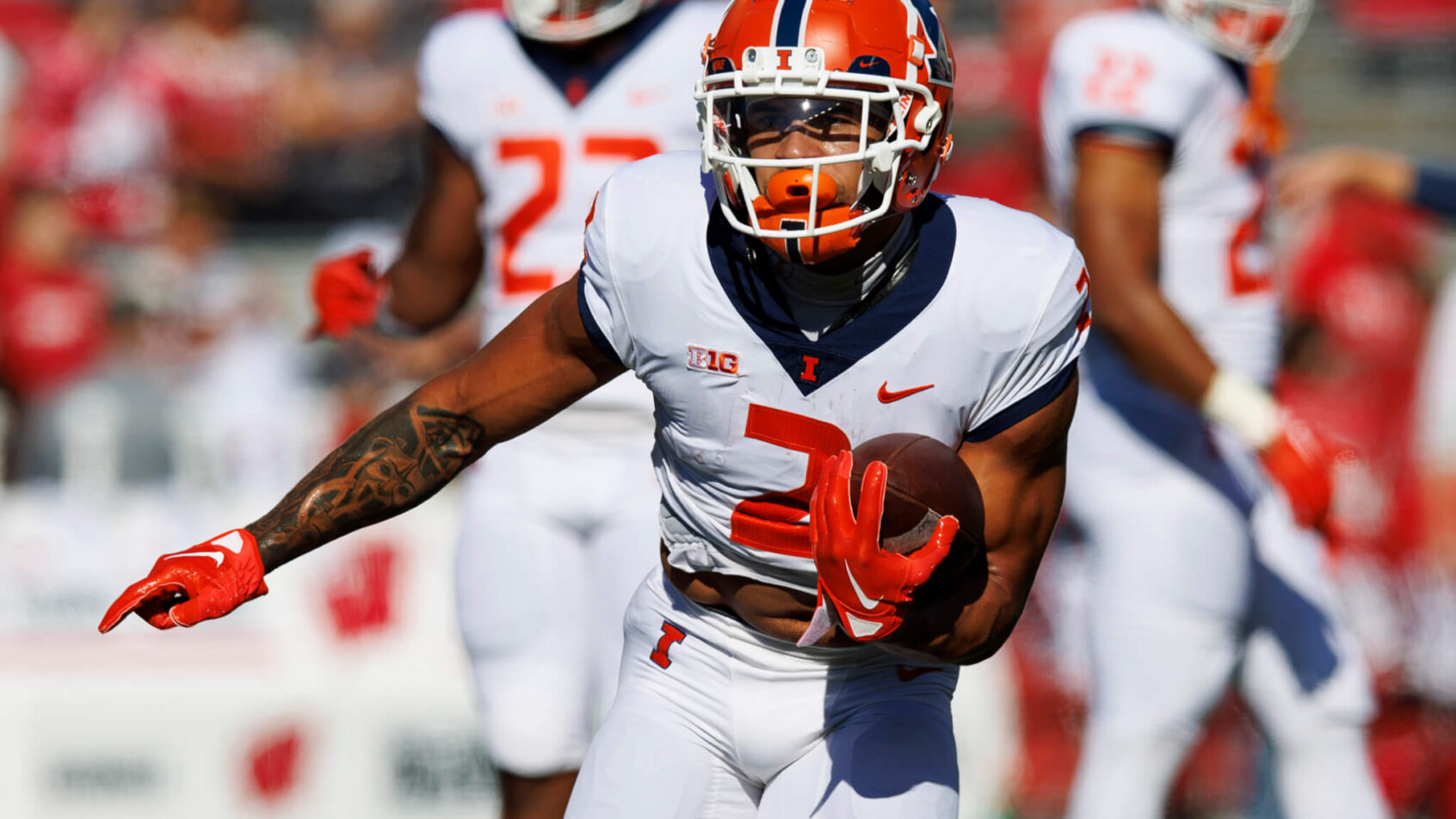 Illinois Fighting Illini running back Chase Brown carries the football
