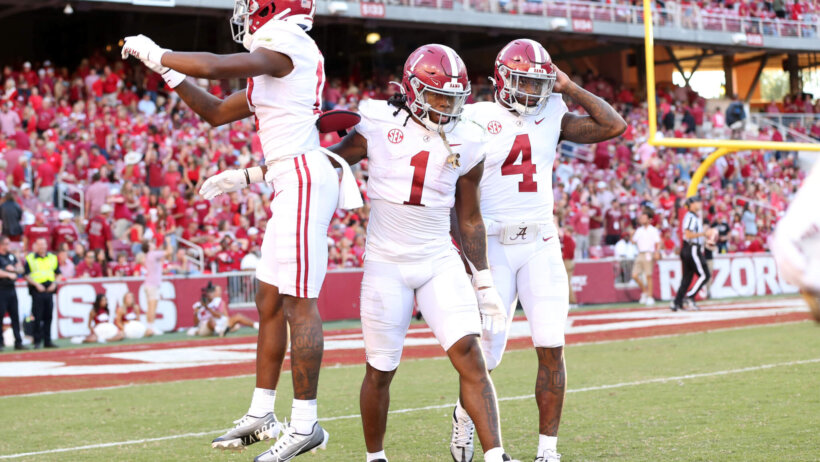 Alabama Crimson Tide running back Jahmyr Gibbs celebrates with wide receiver Isaiah Bond and quarterback Jalen Milroe after scoring