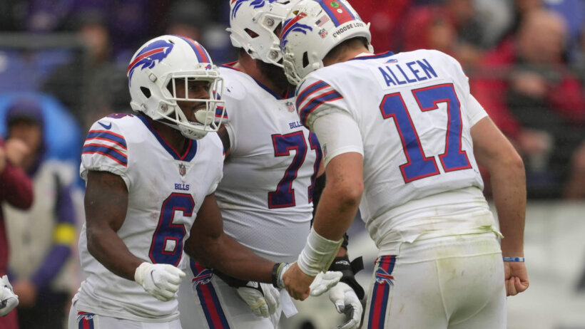 Josh Allen celebrates with Bills players
