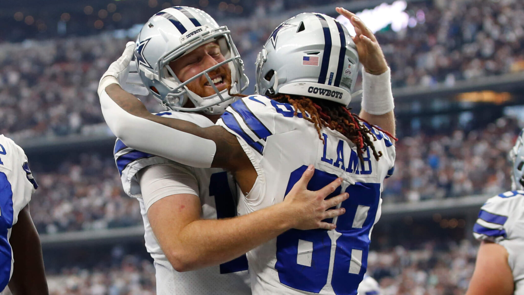 Cooper Rush hugs CeeDee Lamb