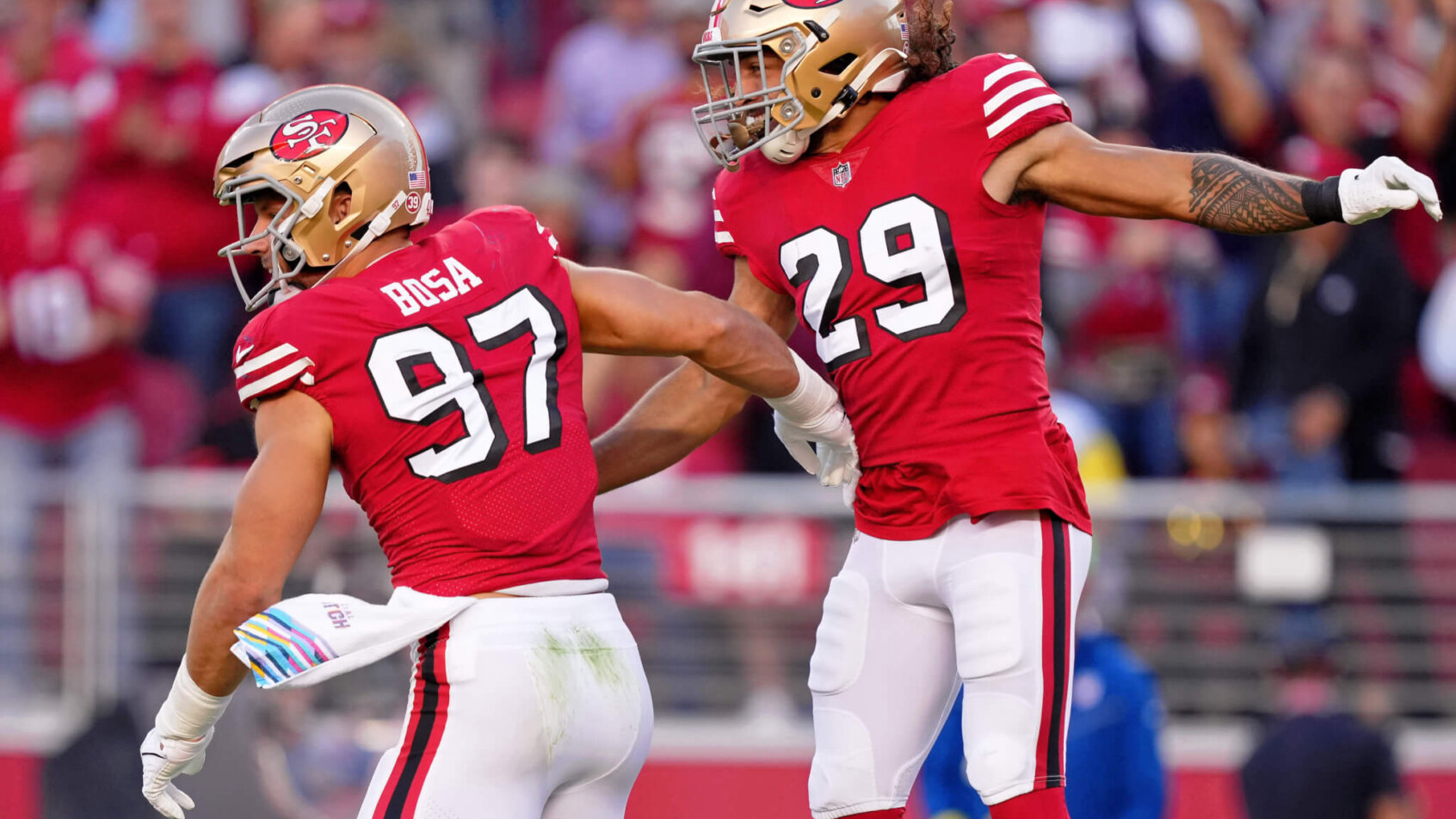 San Francisco 49ers defensive end Nick Bosa celebrates with safety Talanoa Hufanga