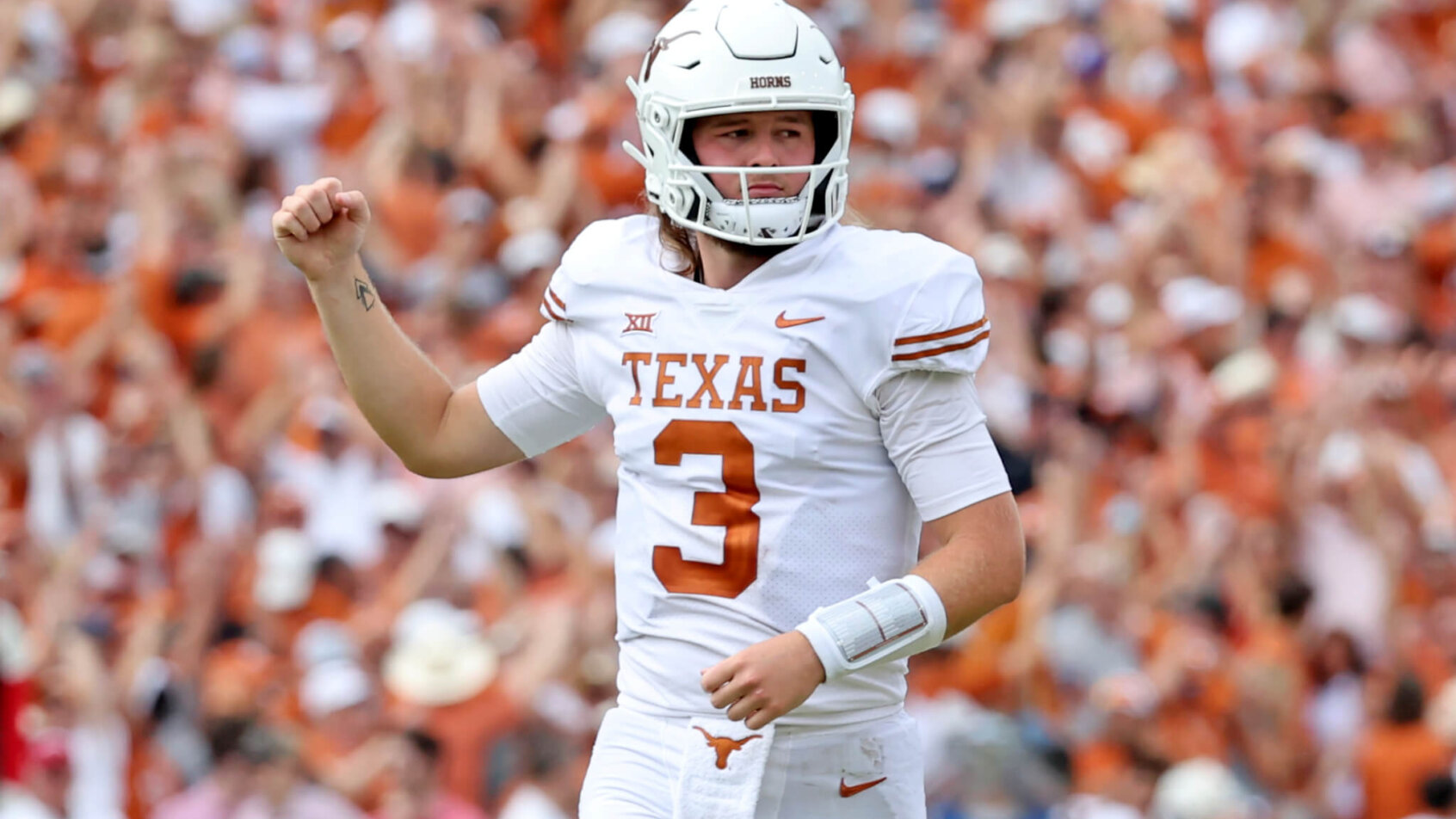 Quinn Ewers reacts to a TD pass