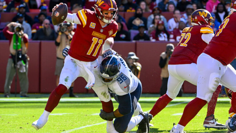 Carson Wentz getting tackled by defender