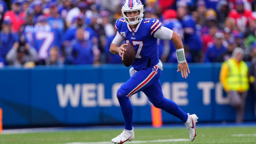 Buffalo Bills quarterback Josh Allen runs with the ball