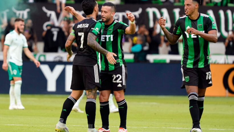 Austin FC forward Sebastián Driussi celebrates scoring a goal with teammates during the second half against the Colorado Rapids