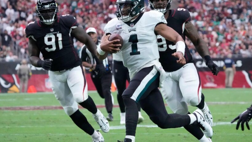 Philadelphia Eagles quarterback Jalen Hurts running with the ball