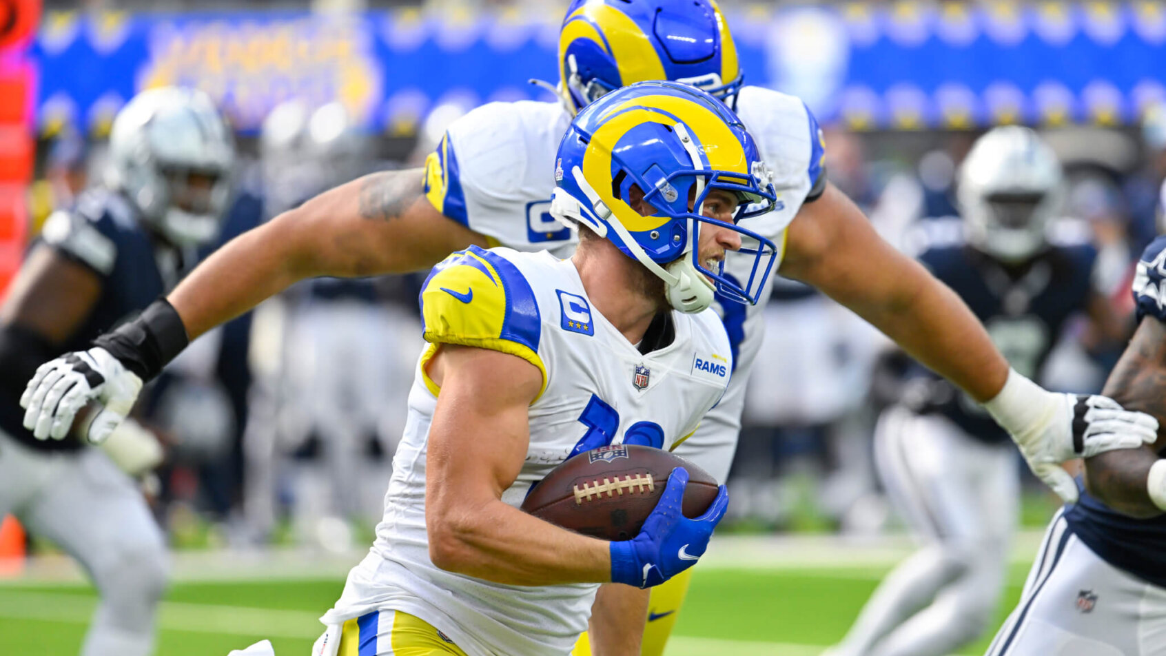 Los Angeles Rams wide receiver Cooper Kupp carries the ball as offensive tackle Rob Havenstein follows