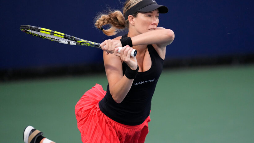 Danielle Collins hitting a shot during a tennis match at the San Diego Open.