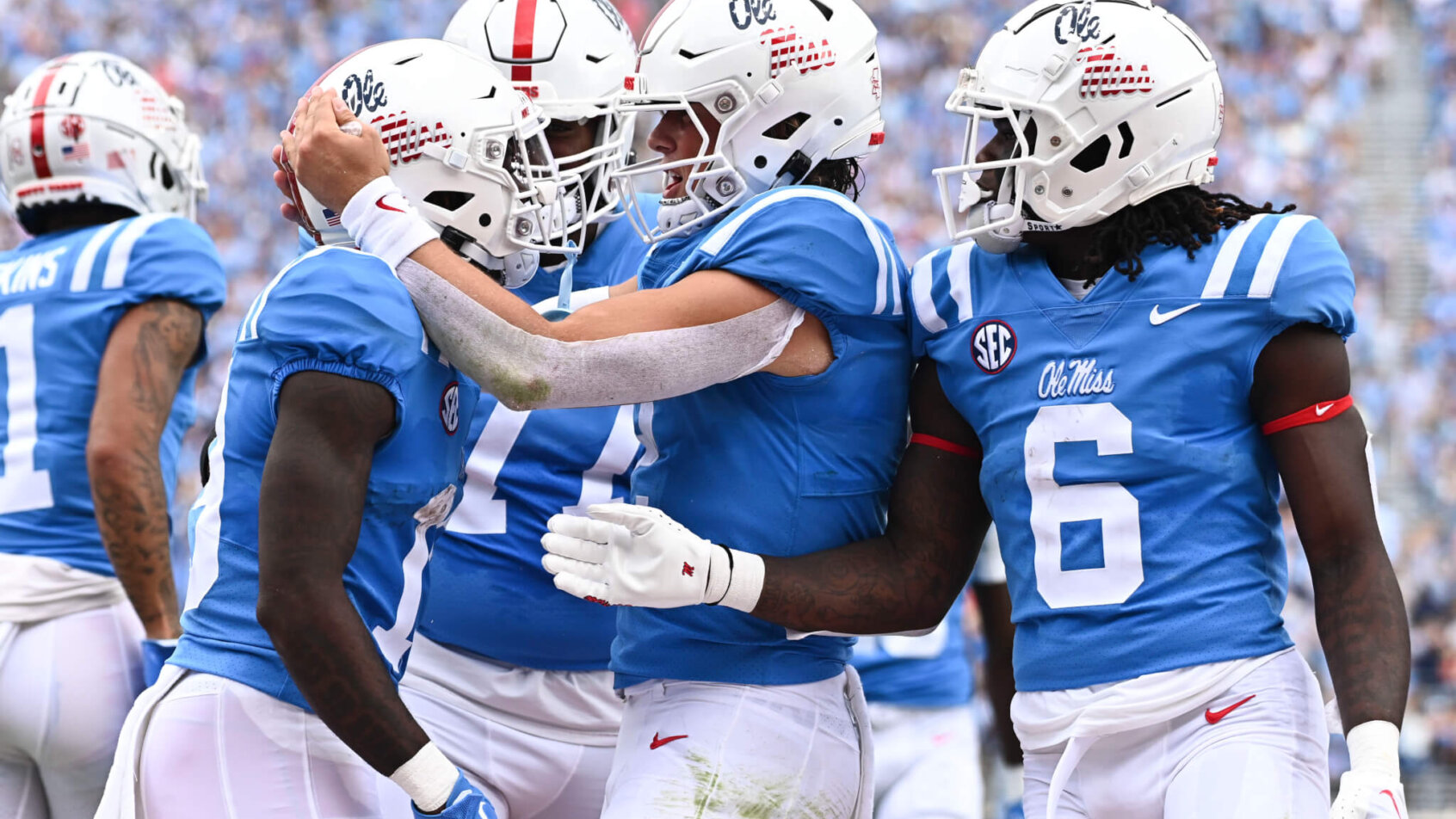 Ole Miss wide receiver Dayton Wade reacts with quarterback Jaxson Dart and running back Zach Evans