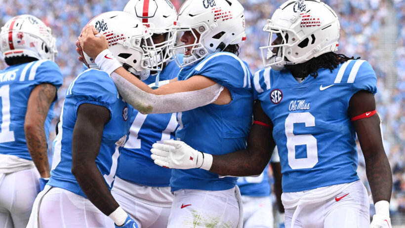 Ole Miss wide receiver Dayton Wade reacts with quarterback Jaxson Dart and running back Zach Evans