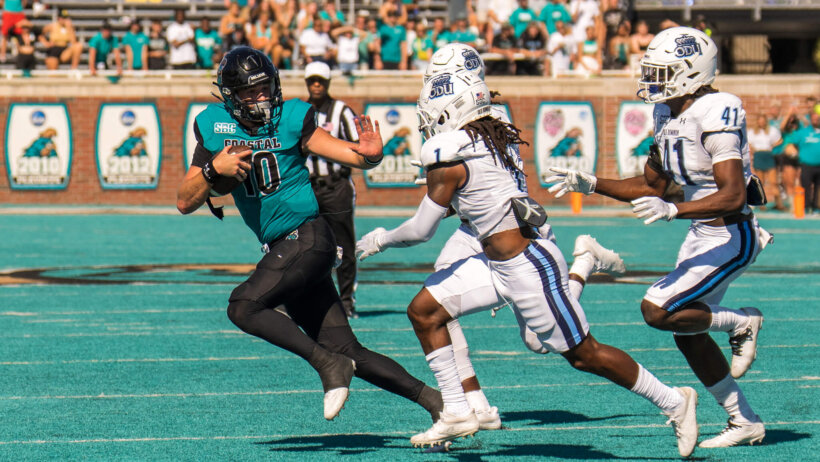 Coastal Carolina Chanticleers quarterback Grayson McCall runs the ball