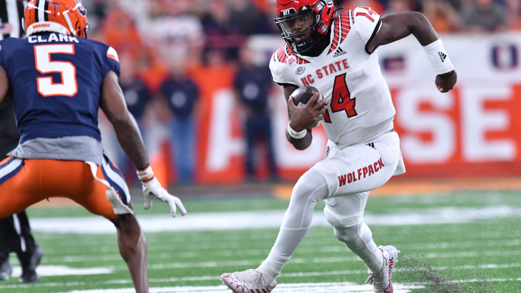 North Carolina State Wolfpack quarterback Jack Chambers prepares to make contact