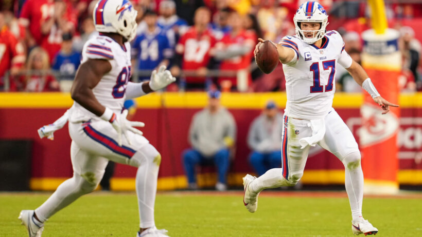 Josh Allen pointing with football