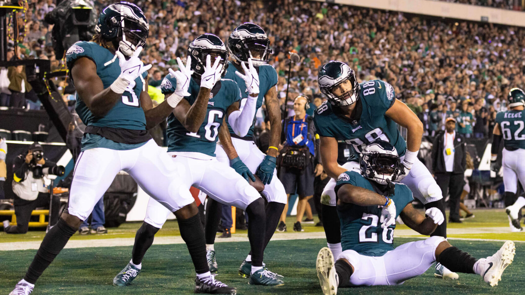 Eagles players posing in the end zone