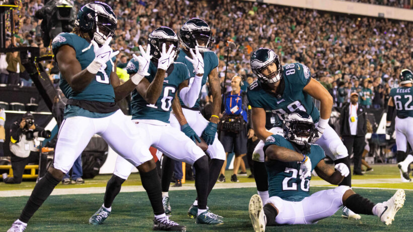 Eagles players posing in the end zone