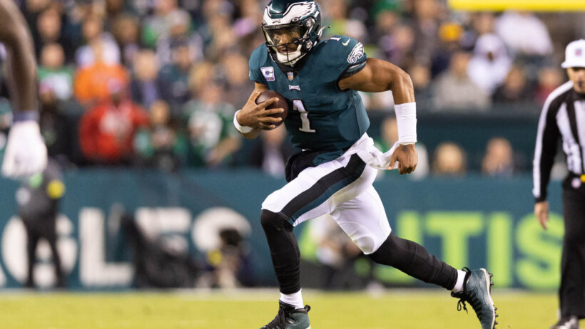 Philadelphia Eagles quarterback Jalen Hurts runs with the ball