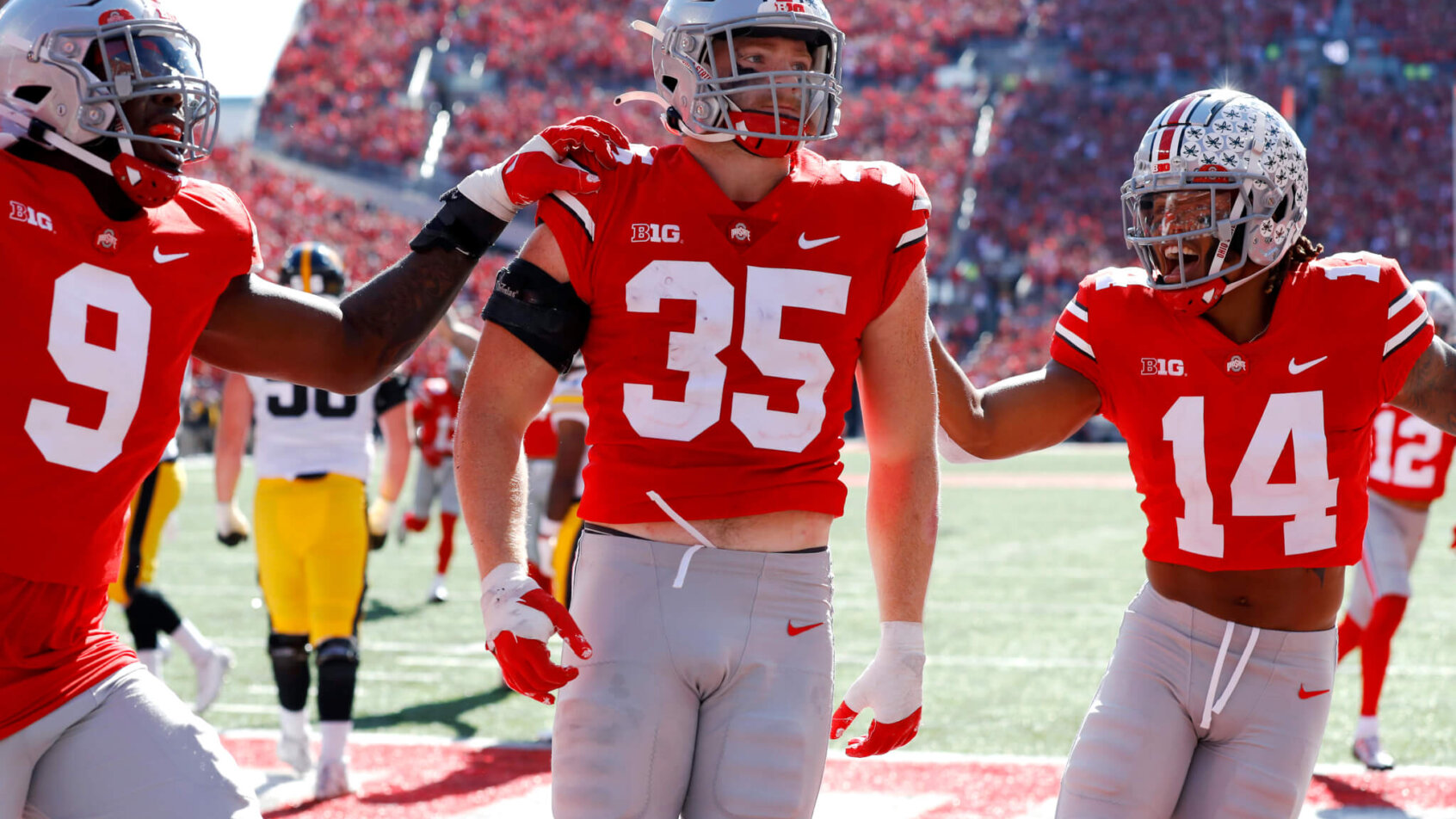 Ohio State Buckeyes defensive players celebrate a return TD