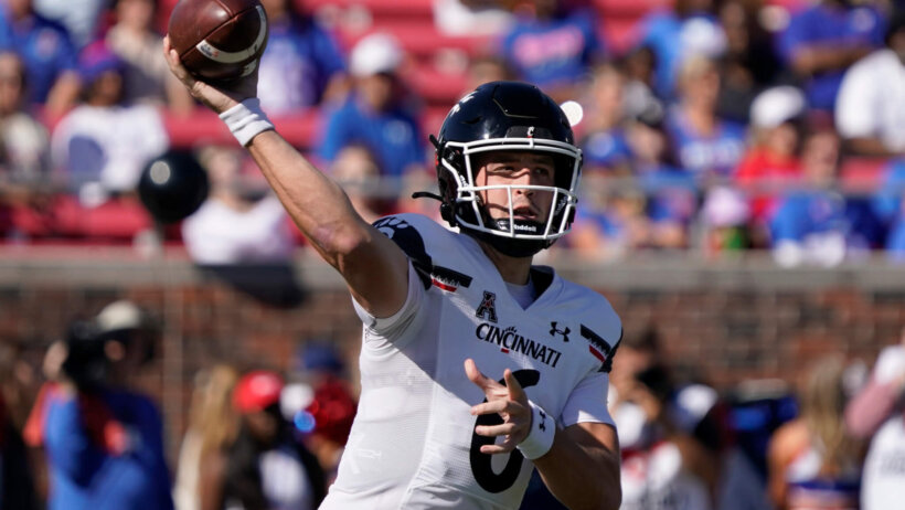 Cincinnati Bearcats quarterback Ben Bryant throws downfield