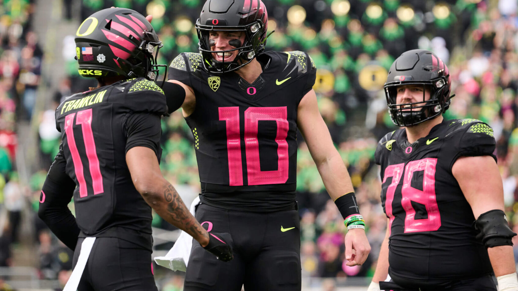 Oregon Ducks wide receiver Troy Franklin celebrates with quarterback Bo Nix