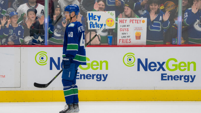 Vancouver Canucks forward Elias Pettersson skates in front of fans during warm up prior to a game