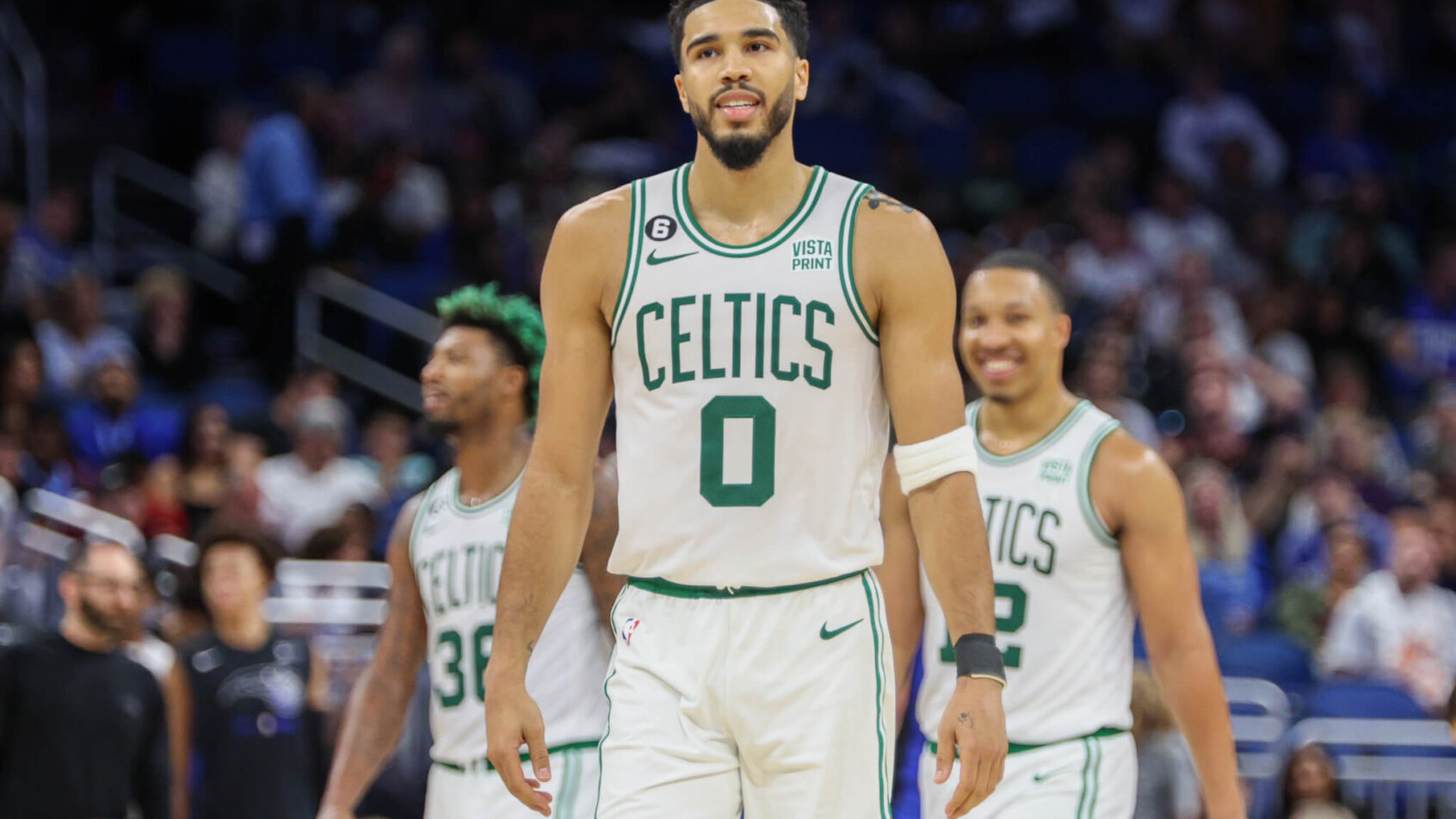 Jayson Tatum walks off the court