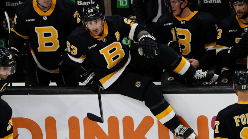 Boston Bruins left wing Brad Marchand hops the boards for a shift