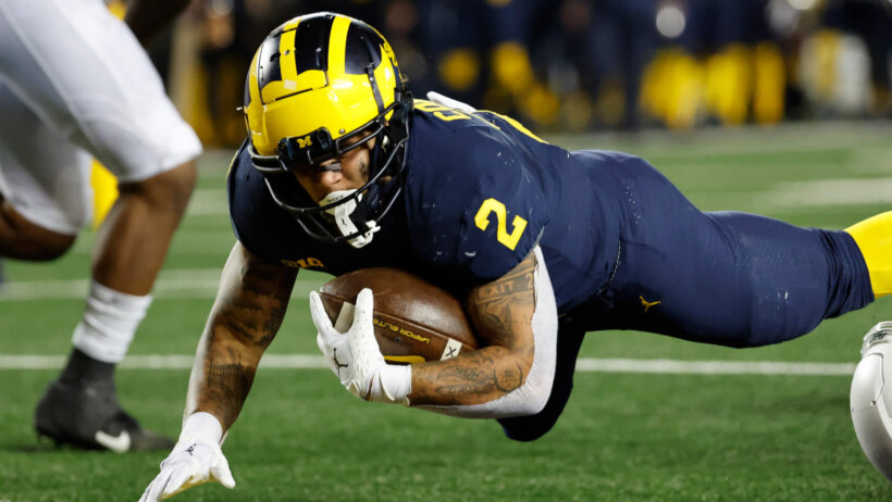 Blake Corum dives for endzone