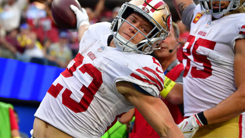 Christian McCaffrey spiking football