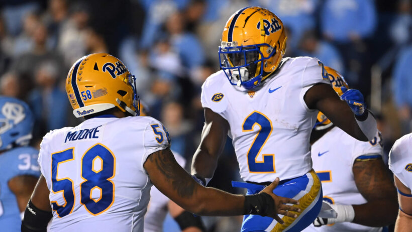 Pittsburgh Panthers running back Israel Abanikanda celebrates with offensive lineman Terrence Moore