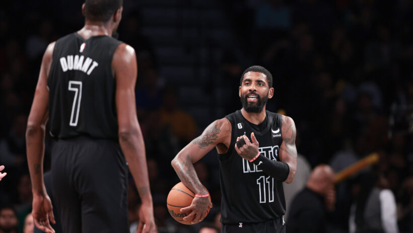 Kyrie Irving talking to Kevin Durant