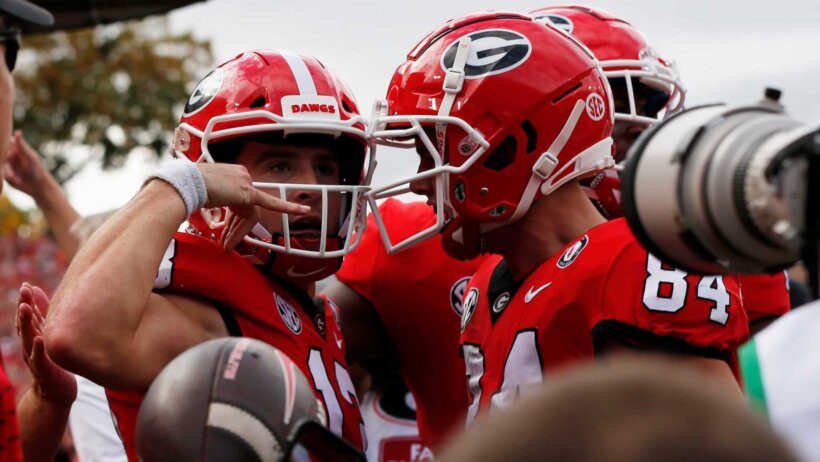 Georgia quarterback Stetson Bennett celebrates with teammates