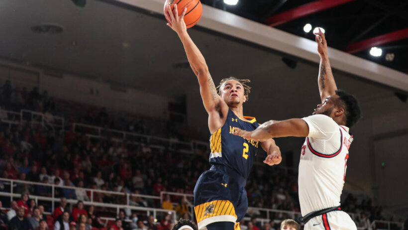 Javon Bennett drives to the hoop versus St. John's.