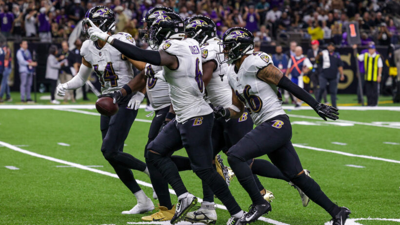 Baltimore Ravens players celebrating interception