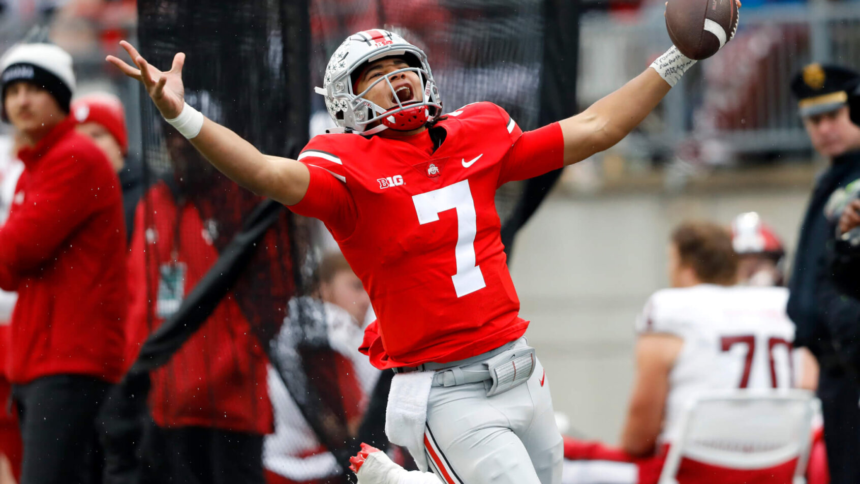 Ohio State Buckeyes quarterback C.J. Stroud runs for the first down