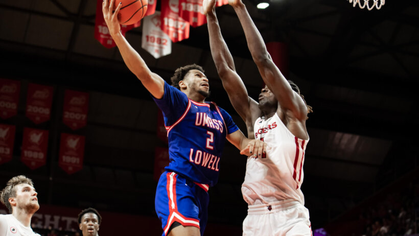 UMass Lowell River Hawks guard Ayinde Hikim rises to the rim