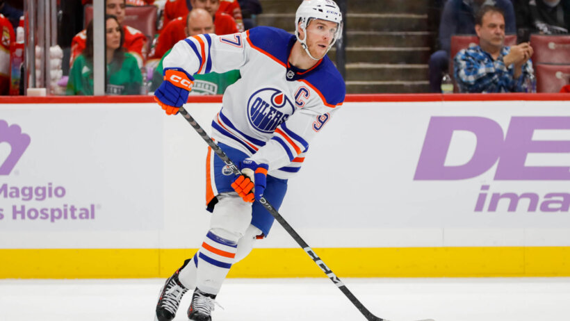 Edmonton Oilers center Connor McDavid moves the puck