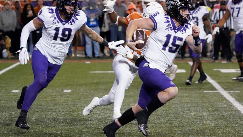 Texas Christian Horned Frogs quarterback Max Duggan keeps the ball for yards