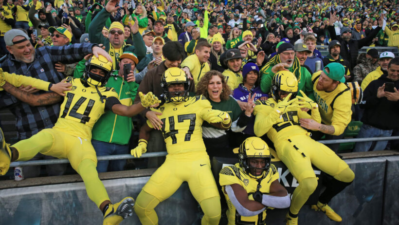 Oregon Ducks leap into the stands
