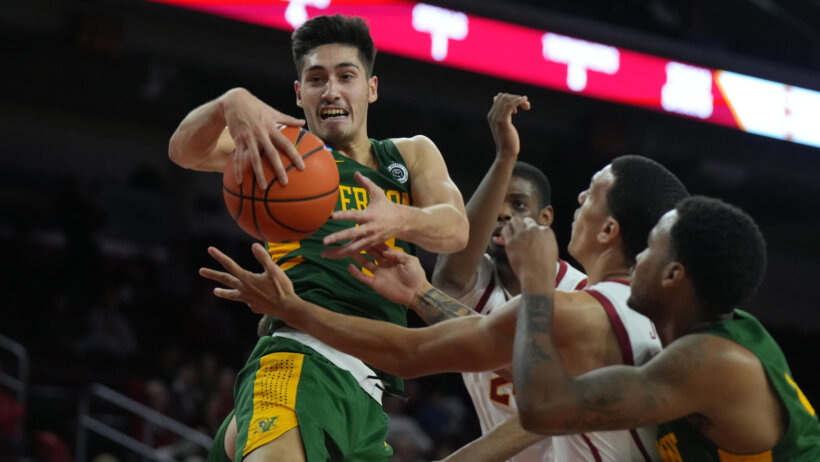 Robin Duncan fights for a loose ball vs USC