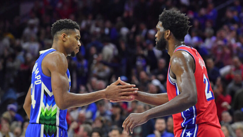 Giannis Antetokounmpo and Joel Embiid shake hands