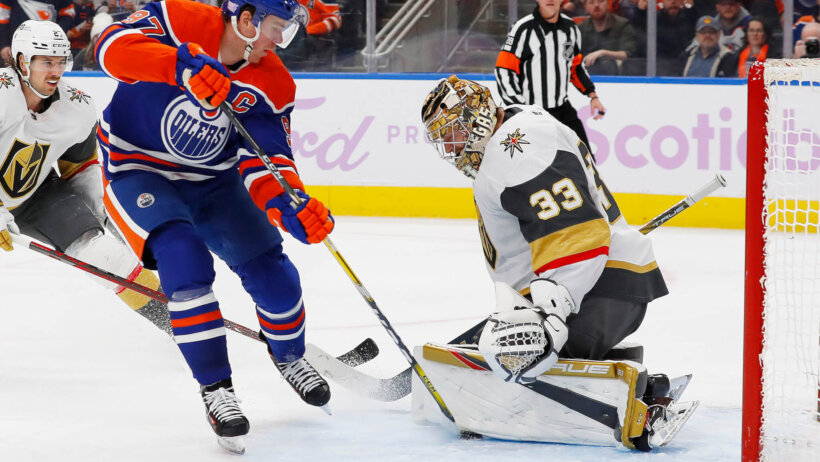 Edmonton Oilers forward Connor McDavid makes a shot on Vegas Golden Knights goalie Adin Hill